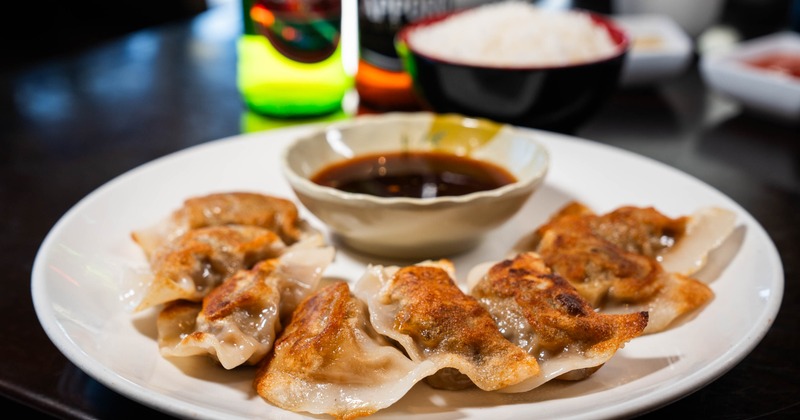 Fried Dumplings with a dipping sauce on the side