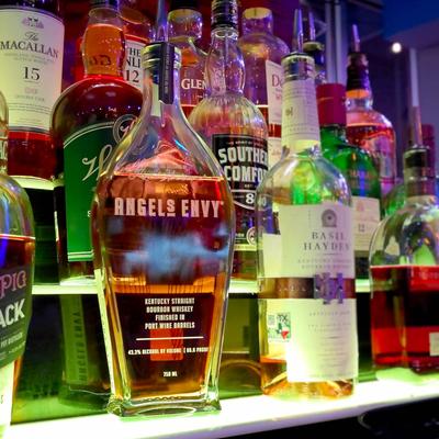 Bottles of hard liquor on shelves.