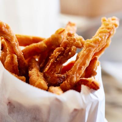 Close up of a bag of french fries.