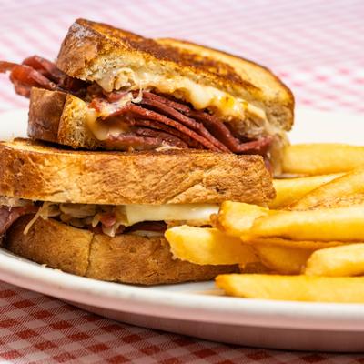 Reuben sandwich served with fries.