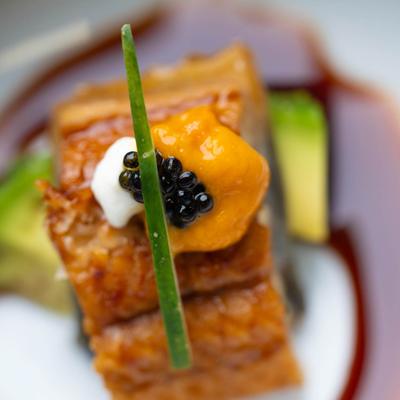 Eel atop avocado, topped with Uni, Cream cheese and Caviar.