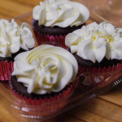 Chocolate cupcakes with white frosting.