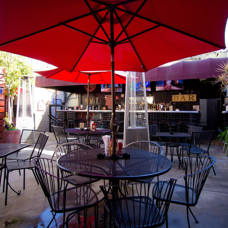 Exterior seating area with parasols and heaters