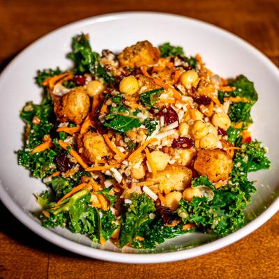 Quinoa kale bowl with grated carrots and chickpeas.