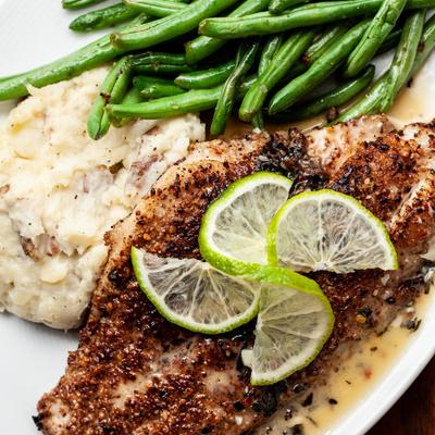 Pecan encrusted fried Catfish with mashed potatoes and pole beans southern food style