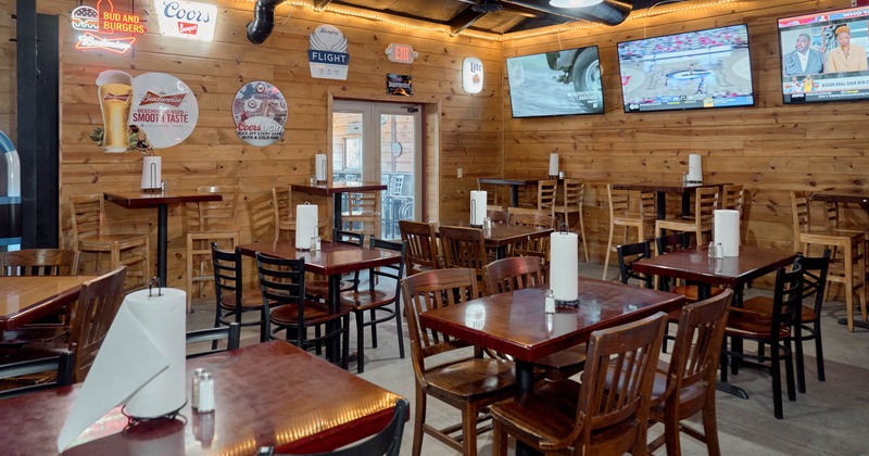 Interior, seating area with wooden tables and chairs