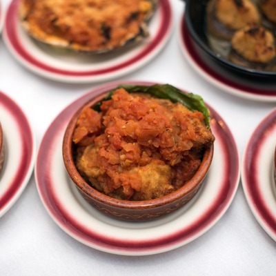 Saucy dish in a bowl with a green decoration