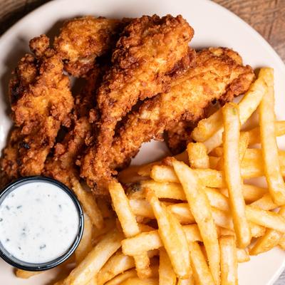 Chicken Tenders, served with fries, and dip.