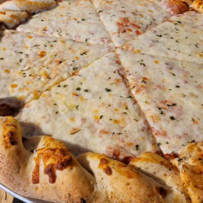 Whole Cheese pizza, close-up.