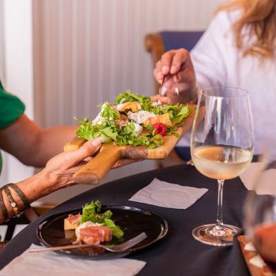 Guests sharing food at a table.