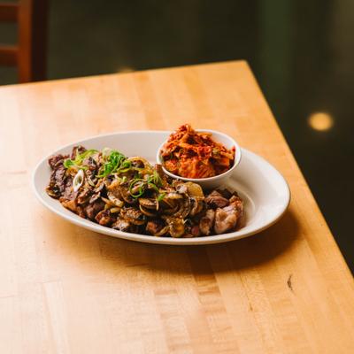 Kalua pork with kimchi and sauteed vegetables.