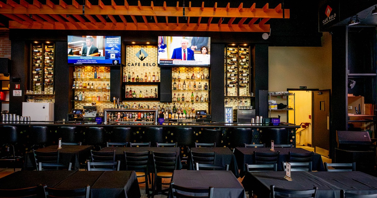 Interior, chairs and tables, bar area in the background