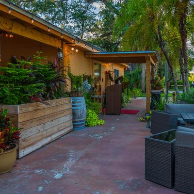 Outdoor space, seating and greenery decor.