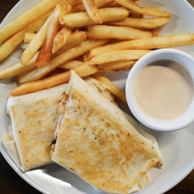 Double Par Spicy Chicken Wrap paired with fries and creamy dipping sauce.