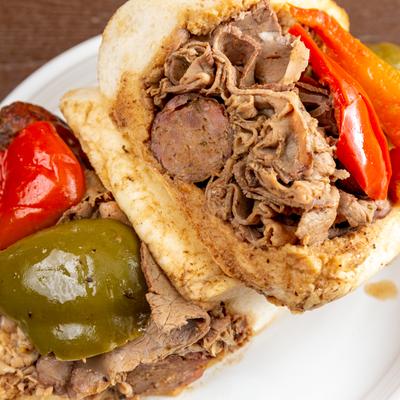 Italian beef and sausage combo sandwich with bell pepper.