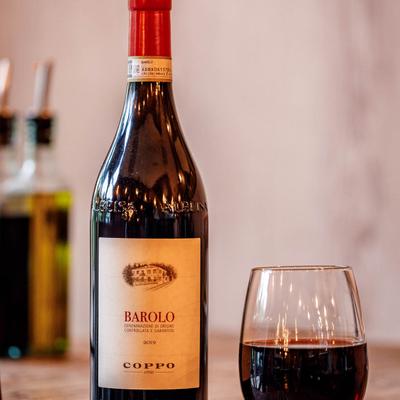 Bottle and glass of red wine.