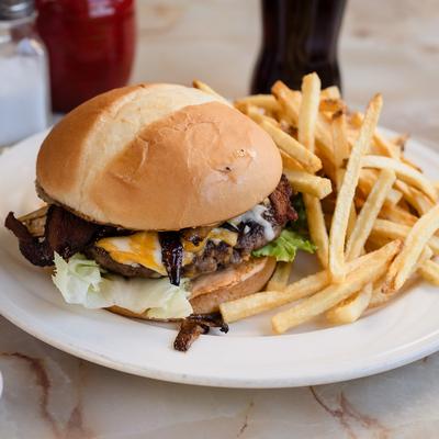 Cheeseburger served with fries.
