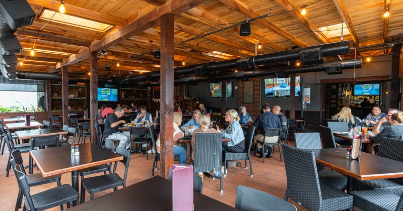 Interior, tables, chairs, customers, lighting, LED screens, lighting