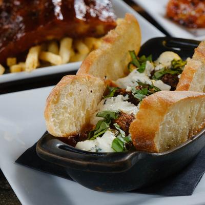 Meatball sandwich with goat cheese.