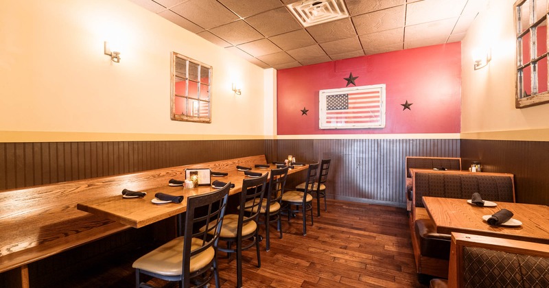 Interior, booth area on the right, tables and chairs on the left