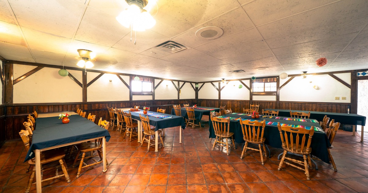 Interior, seating area with wooden tables and chairs