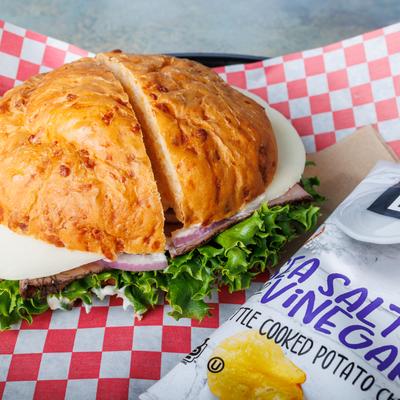 Roast Beef sandwich served with salt and vinegar chips.