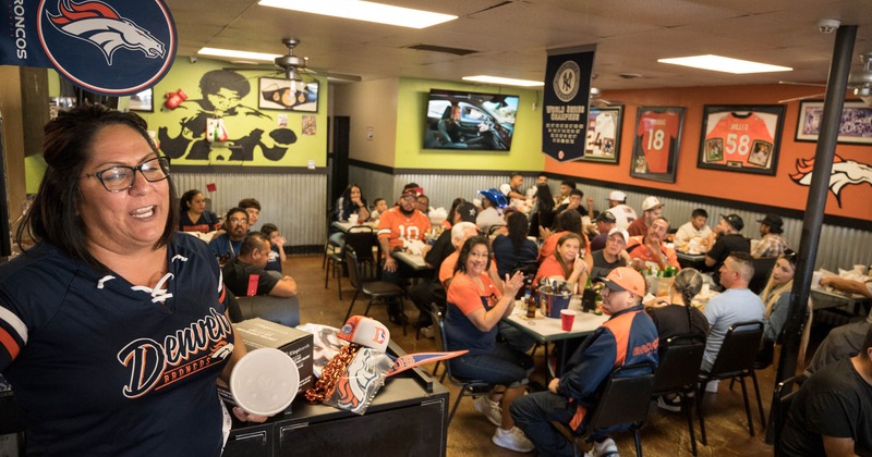 Interior, diner area, party with guests and animator in front