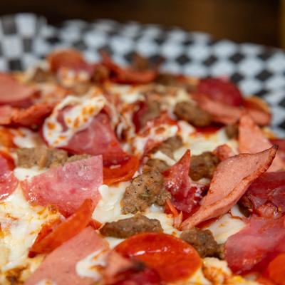 Meat Lovers Pizza, closeup.