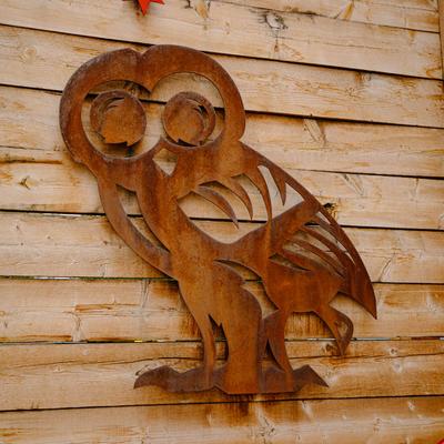 Exterior, wooden owl decoration on a wall