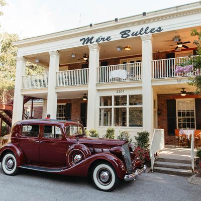 Vintage car parked outside the restaurant.