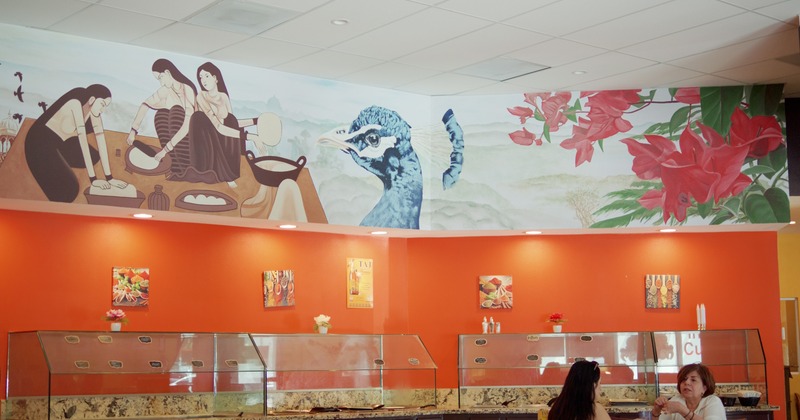 Food counter, wall paint above, guests seating in front