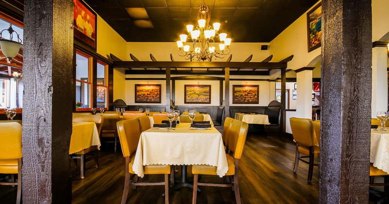 Restaurant interior, dining area with set tables