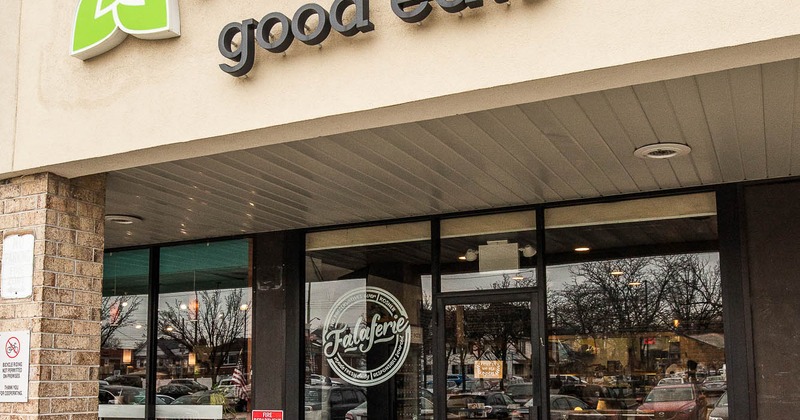 Exterior, seating area in front of the entrance door