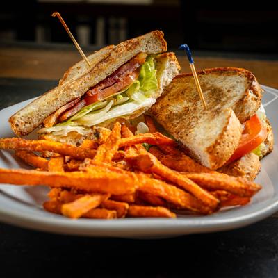 BLT served with sweet potato fries.