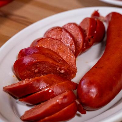 Hot link on a white plate.