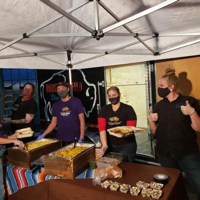 Staff members serving catering food