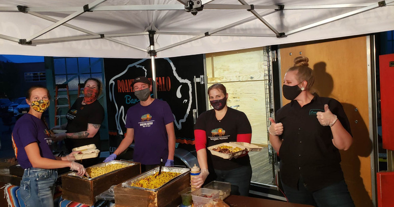 Staff members serving food