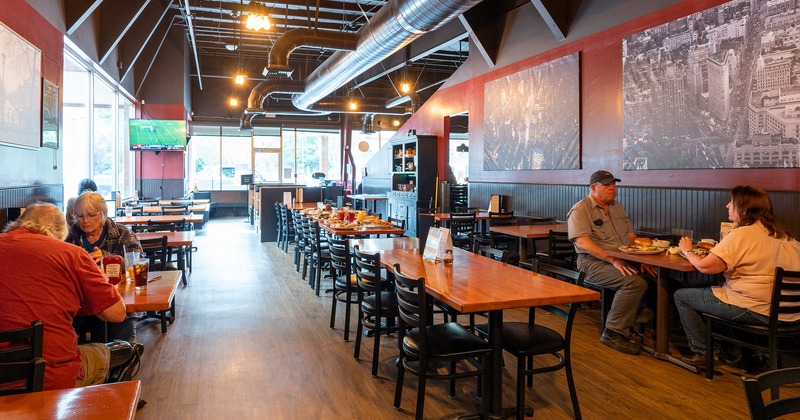 Interior, dining area, guests enjoying their food and drinks