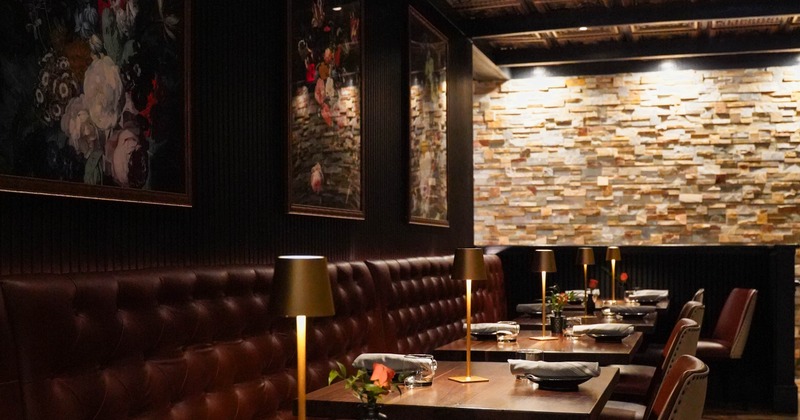 Interior, tables, chairs and high back, buttoned leather benches