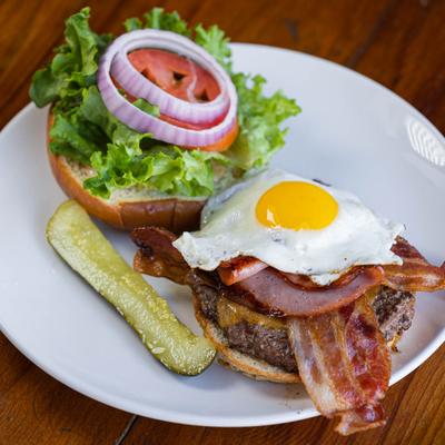 Grilled bacon, fried egg and salad on the side