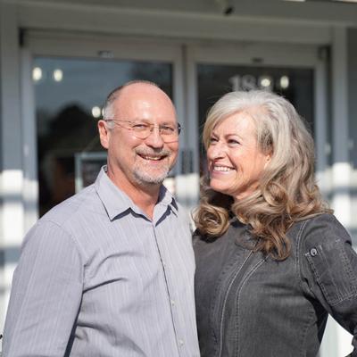 Two owners posing together.