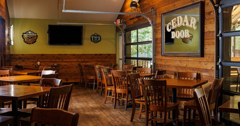 Interior, dining area with wood elements, TV and decoration on the wall