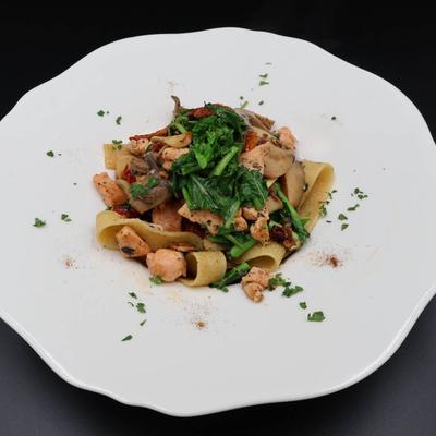 Pappardelle pasta with grilled chicken and broccoli rabe.