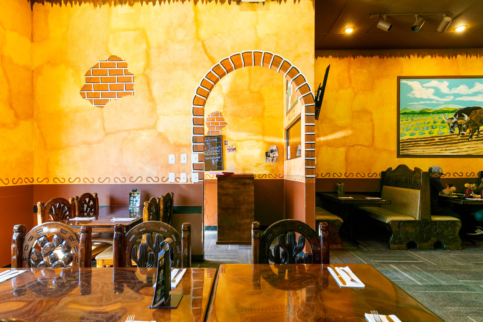 Interior, dining area with tables, traditional chair and booth design, retro wallpaper