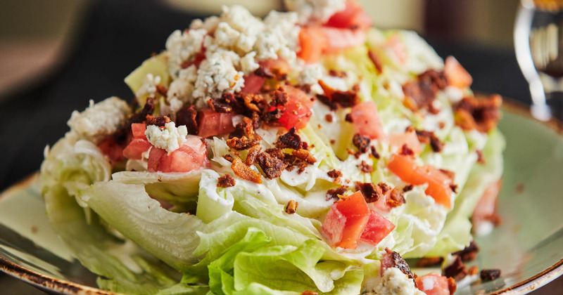 Salad with mixed vegetables and sliced meat