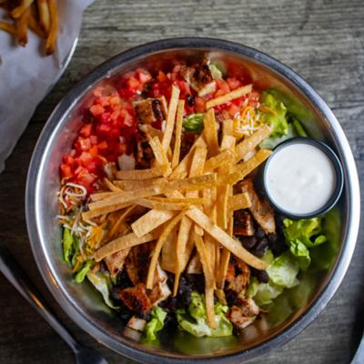 The 3rd salad served with tortilla strips on top and ranch dressing.