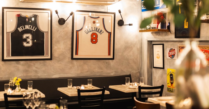 Interior, tables and chairs, framed jerseys on the wall