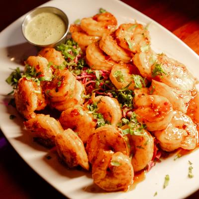 Sweet and Spicy Shrimp served with a dipping sauce.