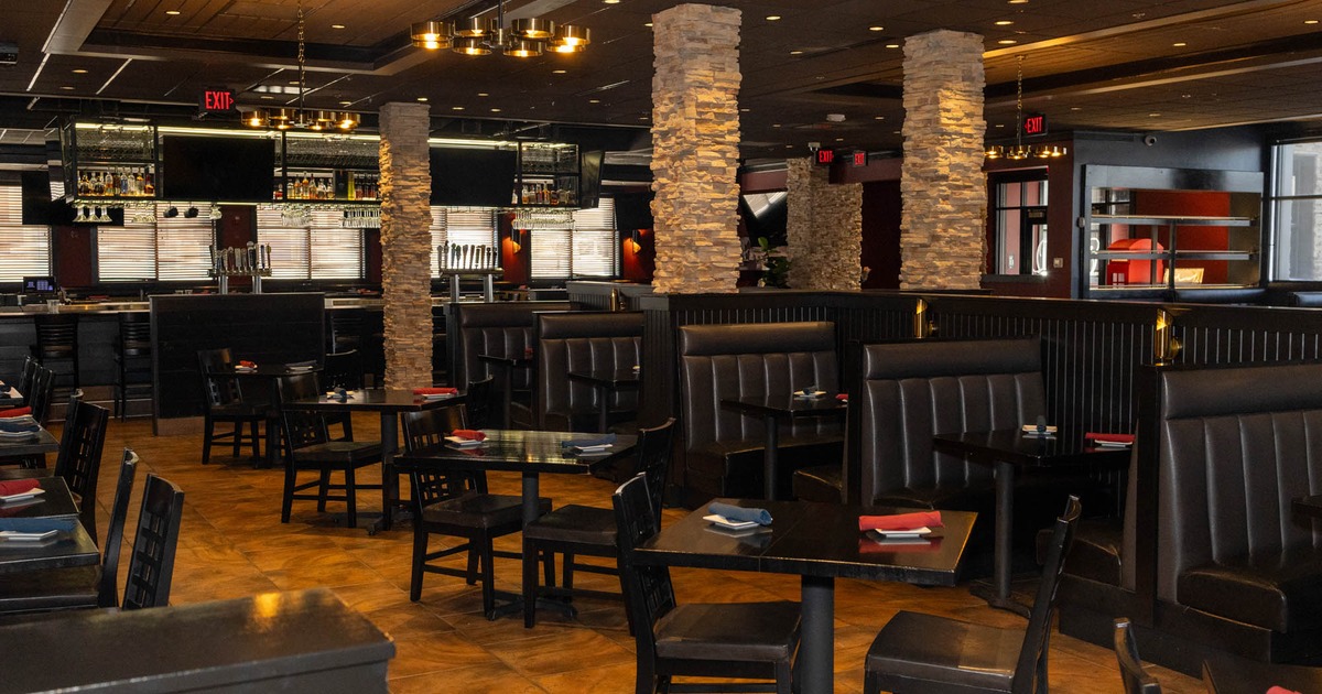 Interior, seating area with tables, chairs and booths