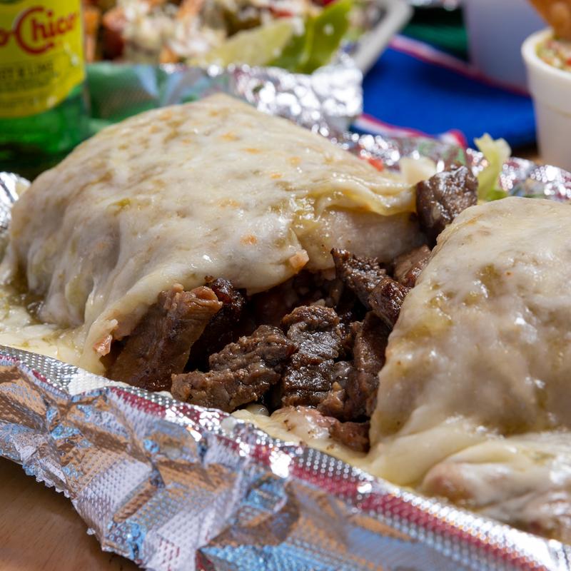 Burrito smothered in your choice of Chile Verde or Mole Sauce and melted cheese!